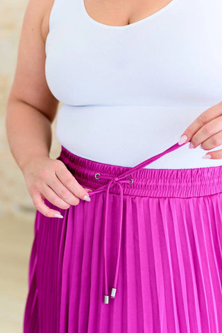 Just a Flirt Pleated Skirt in Magenta Ave Shops